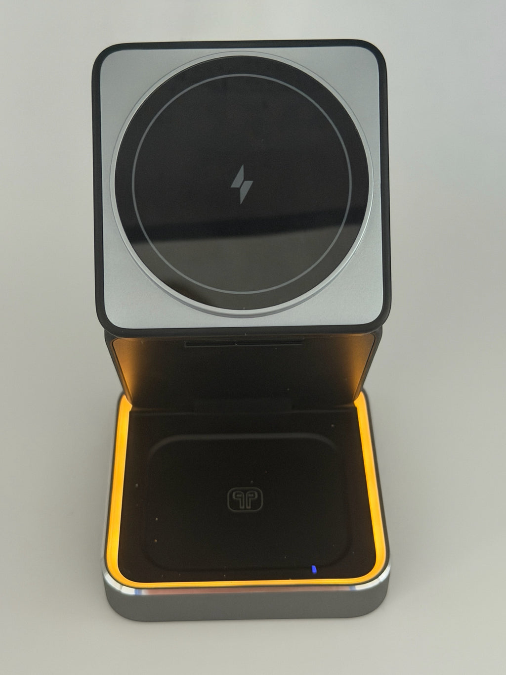 GLOVOYAGE™ 3-in-1 foldable wireless charging station in grey with a built-in night light for phone, watch, and earbuds.