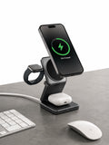 GLOVOYAGE™ 3-in-1 foldable wireless charging station in grey, powering a smartphone, smartwatch, and earbuds on a desk.