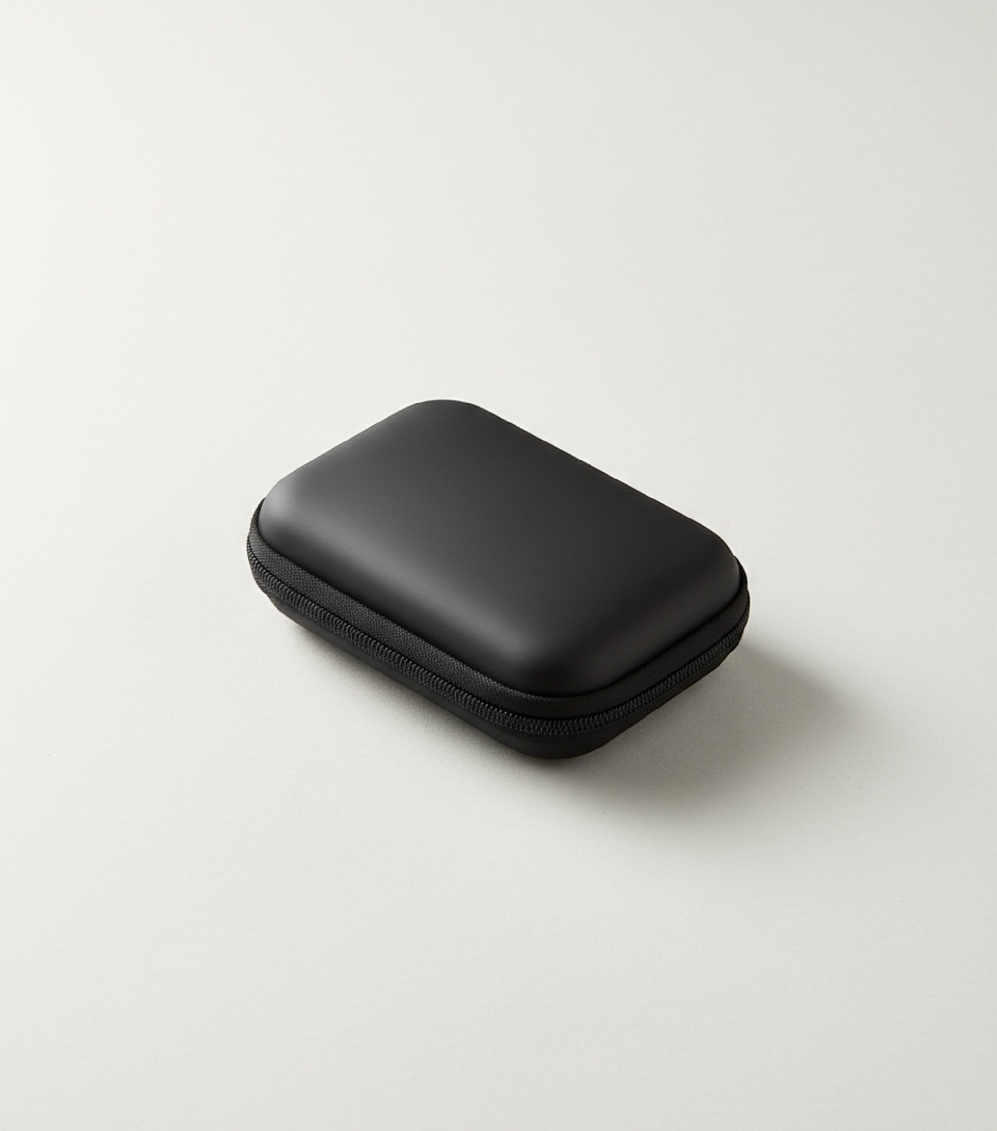 GLOVOYAGE™ AirCase Mini Tech Organizer in black, a durable EVA hard shell travel case for earbuds and small tech.