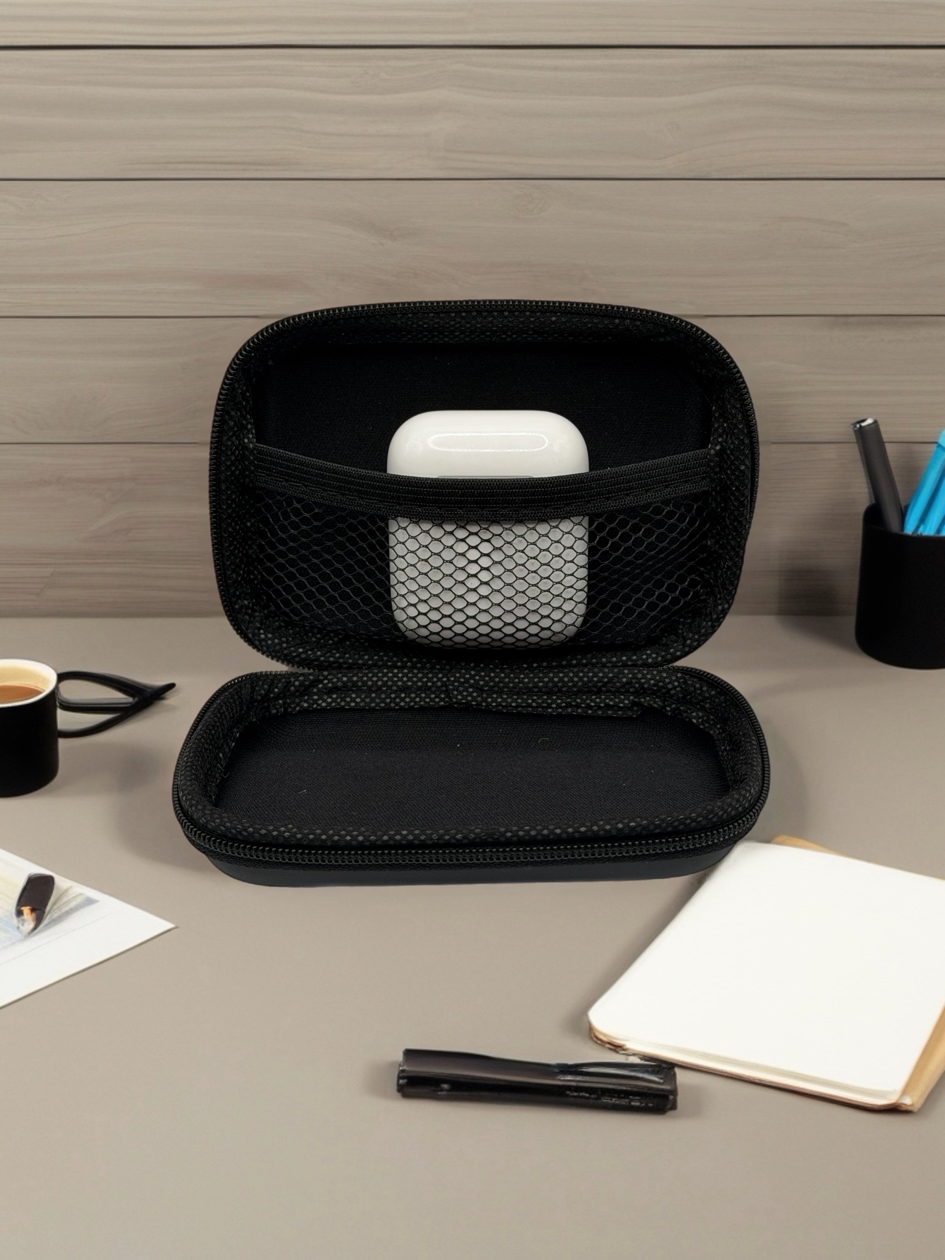 GLOVOYAGE™ AirCase Mini Tech Organizer with a white earbud case inside, featuring a durable black EVA hard shell.