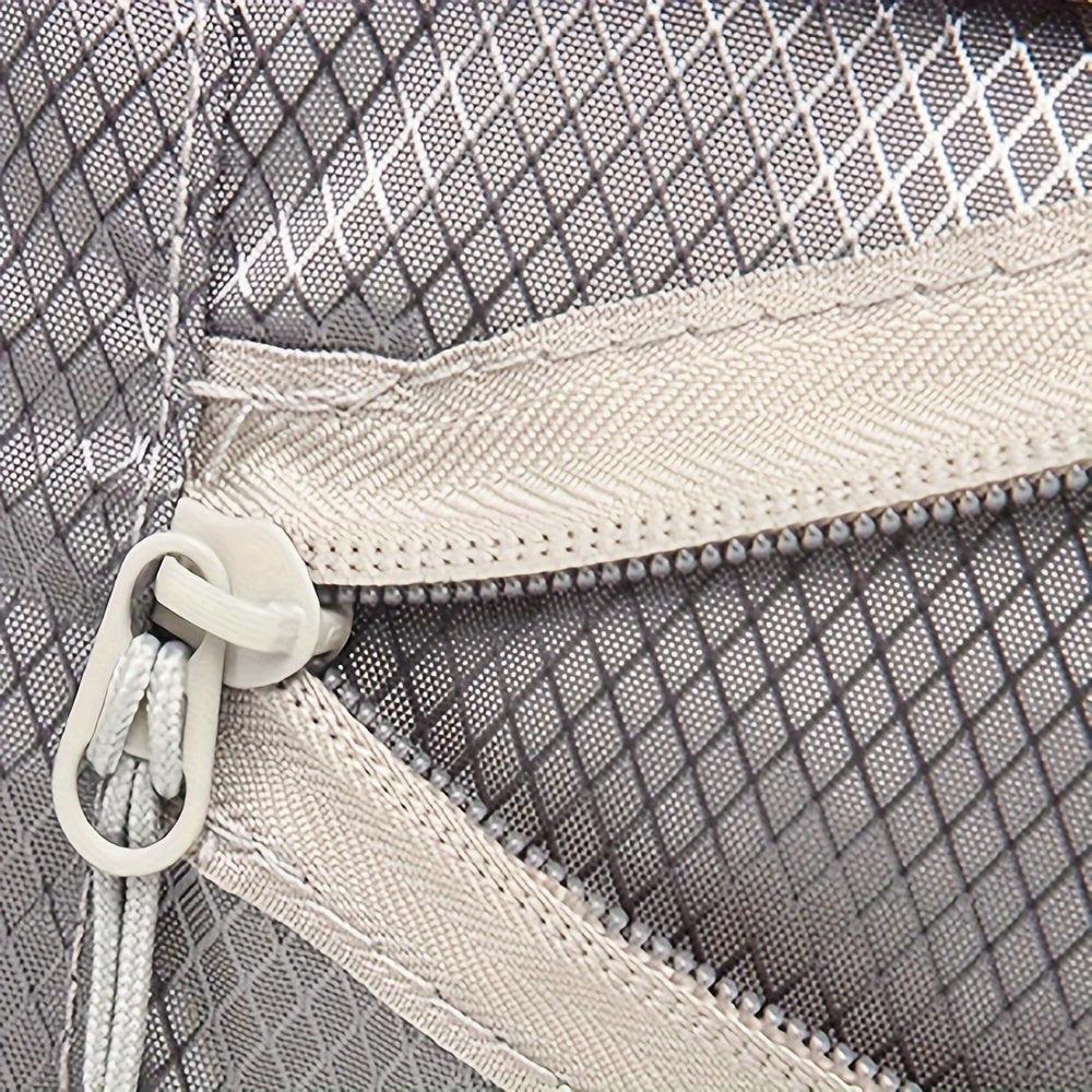 Close-up of GLOVOYAGE™ compression packing cube showing durable grey diamond-pattern fabric and sturdy zipper detail.