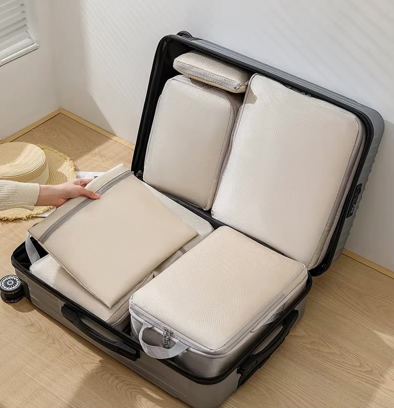 GLOVOYAGE™ 6-piece beige compression packing cube set organized inside a grey suitcase for efficient travel storage